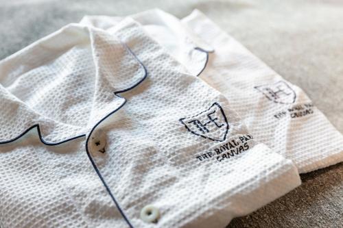 a close up of two white napkins on a table at The Royal Park Canvas - Ginza 8 in Tokyo