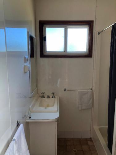 a bathroom with a sink and a window at BIG4 Taggerty Holiday Park in Taggerty