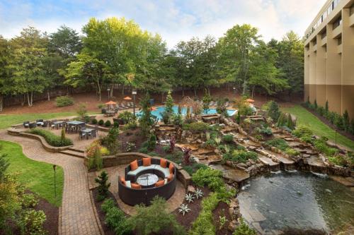 an aerial view of a garden with a pool at Hyatt Regency Suites Atlanta Northwest in Atlanta