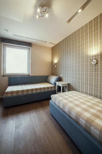 Postel nebo postele na pokoji v ubytování Geras miegas