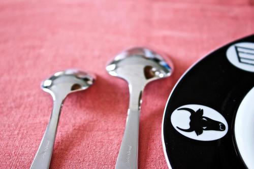 three spoons sitting on top of a red table at Le Pont Rouge Roulotte in Sylvéréal