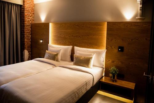 Postel nebo postele na pokoji v ubytování GINN Hotel Hamburg Elbspeicher