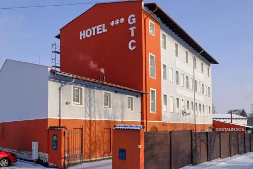 a building with a hotel sign on the side of it at Hotel GTC 3* superior in Bílovec