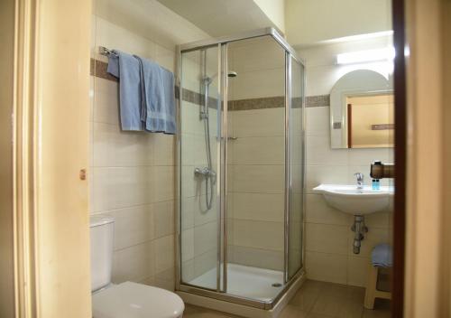 Koupelna v ubytování Elysso Hotel