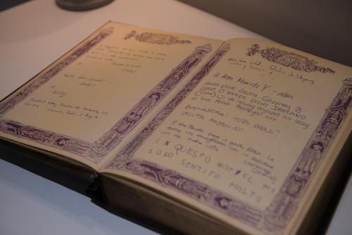 an open book sitting on top of a table at Irini Hotel in Heraklio Town