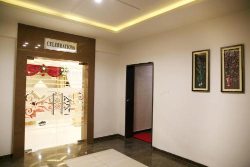 a store entrance with a sign on the wall at Hotel Sitara Grand Miyapur in Hyderabad