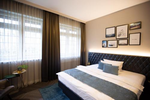 
Ein Bett oder Betten in einem Zimmer der Unterkunft Boutique Hotel Poppenbütteler Hof
