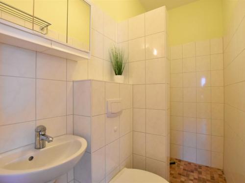a bathroom with a toilet and a sink at Relaxed Apartment in Puerto del Carmen with Swimming Pool in Zierow