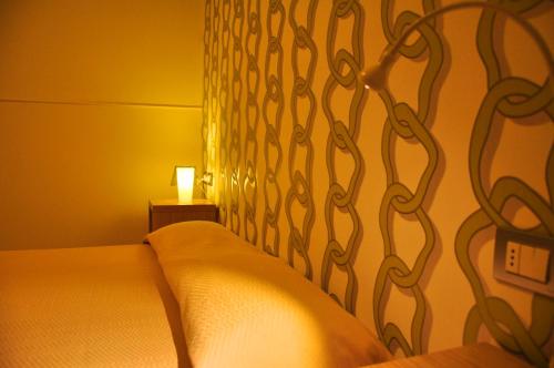 a bedroom with a bed with a metal head board at Letto & Riletto in Montecassiano