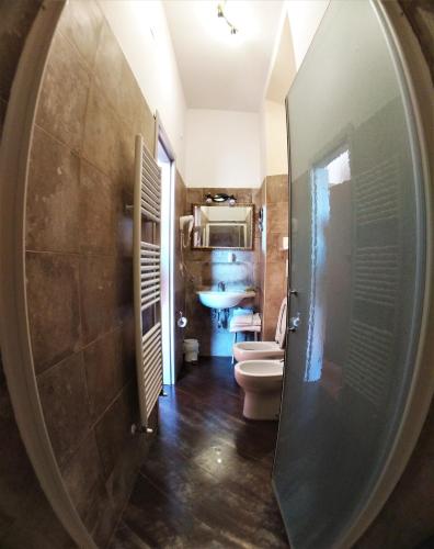 Ein Badezimmer in der Unterkunft Hotel Merlini