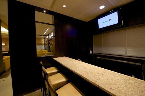 Телевизор и/или развлекательный центр в Days Inn & Suites by Wyndham Winnipeg Airport Manitoba