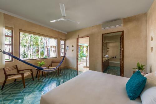 Postel nebo postele na pokoji v ubytování Hotel Tiki Tiki Tulum