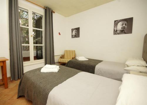 מיטה או מיטות בחדר ב-Jardines De Las Golondrinas