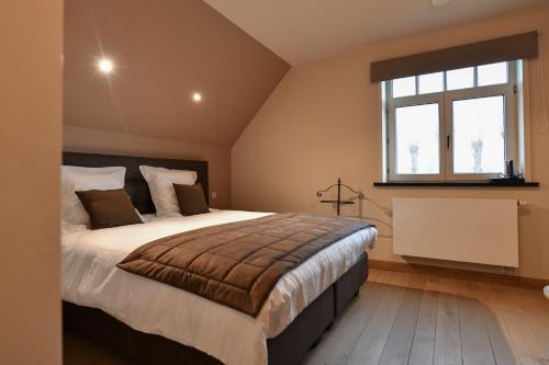 Cama o camas de una habitación en B&B De Waeterhoeve