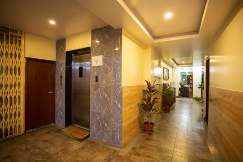 a hallway with a elevator in a building at Hotel Splendid View in Pokhara
