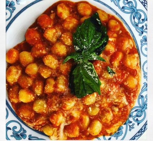 a plate of food with a bowl of stew at Nido Degli Dei in Agerola
