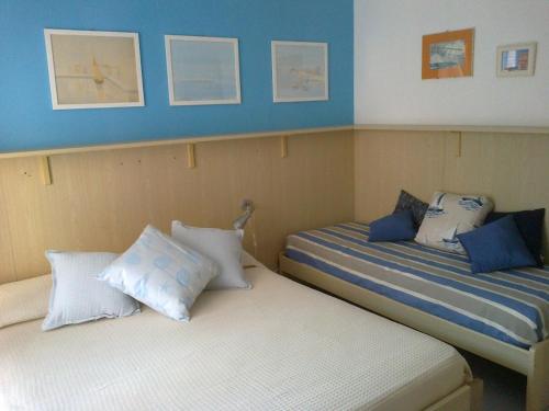 Posteľ alebo postele v izbe v ubytovaní Condominio ai bagni