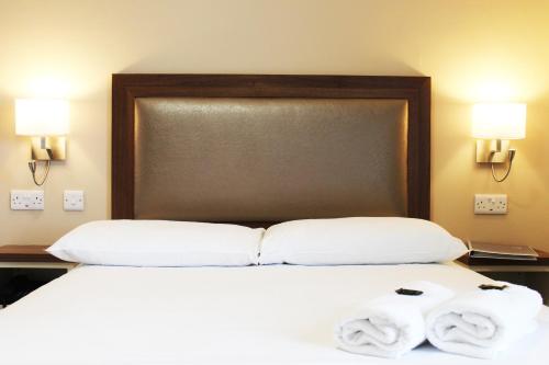 Postel nebo postele na pokoji v ubytování St. Judes Lodge B&B