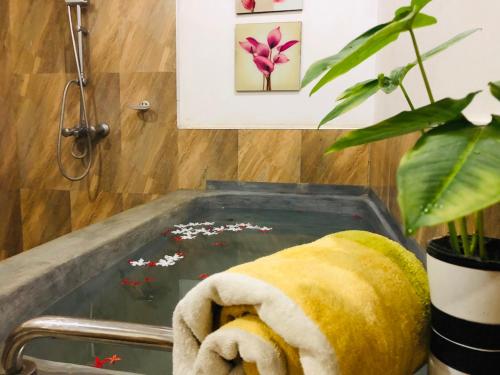 a towel sitting on top of a bath tub at Bangalawa Resort in Habarana