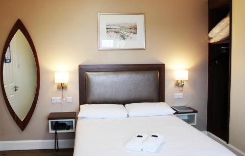 Postel nebo postele na pokoji v ubytování St. Judes Lodge B&B