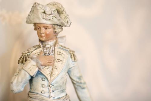 a figurine of a man wearing a hat and tie at Llangattock Park House in Crickhowell