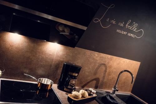 a kitchen with a stove and a counter top at Holiday Home Wonderland with private Spa/Wellness in Ralingen