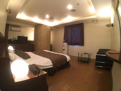 Postel nebo postele na pokoji v ubytování Hotel Orchid (Adult only)