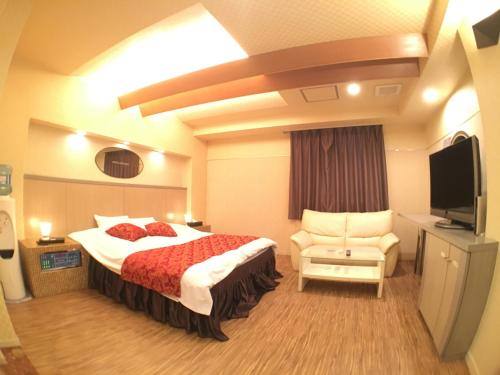 Postel nebo postele na pokoji v ubytování Hotel Orchid (Adult only)