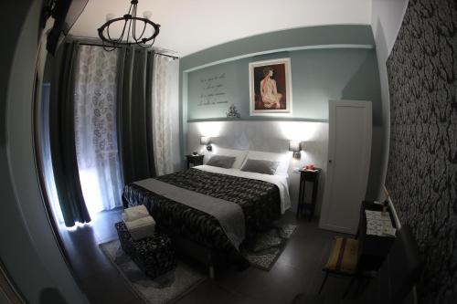 a small bedroom with a bed and a window at La casa di Luce in Reggio Calabria