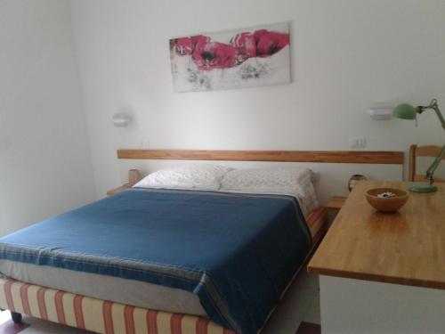 Кровать или кровати в номере L'Oasi di Athena
