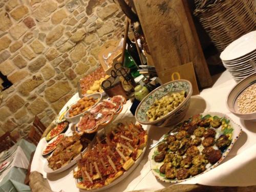 a table with many different types of food on it at Le Querce di Cota in Troina