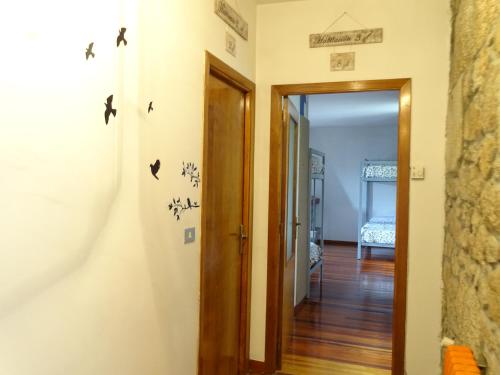 a room with a door leading to a hallway at Albergue Convento Del Camino in Tui