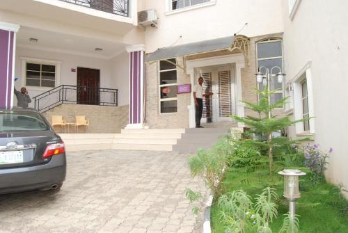a car parked in front of a house at Koraf Hotels in Abuja