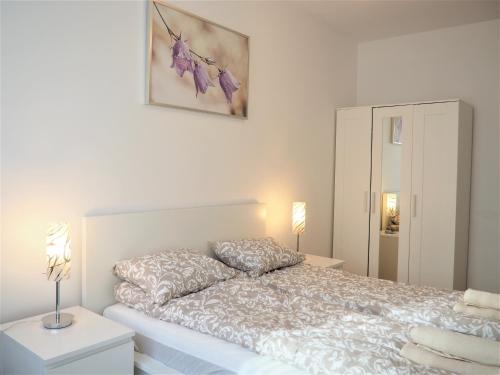 Posteľ alebo postele v izbe v ubytovaní Apartament 3 pokoje, parking, balkon - Gdańsk Centrum