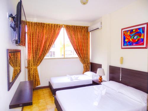 Katil atau katil-katil dalam bilik di Hotel San Nicolás Plaza