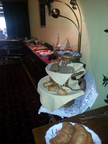 a tray of bread and pastries on a table at Hotel Garni Dietrich in Seefeld in Tirol