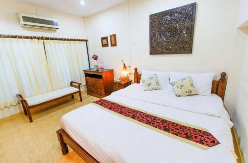 Ένα ή περισσότερα κρεβάτια σε δωμάτιο στο Meewaya Hotel