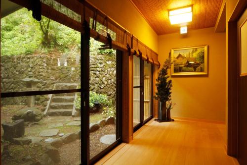 a hallway of a house with a large window at Nobori in Ome