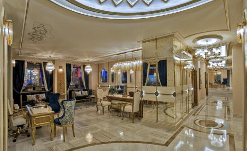 a living room with a table and chairs at Romance Istanbul Hotel Boutique Class in Istanbul