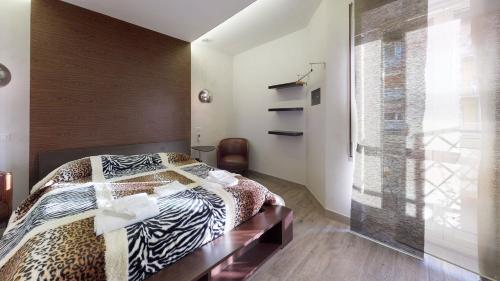 a bedroom with a bed and a glass wall at Let's go to Rome in Rome