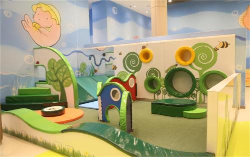 a childrens play room with a slide and a play area at Mangrove Tree Resort World Sanya Bay-Kapok in Sanya