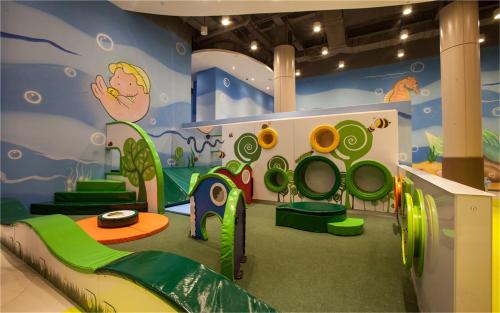 a childrens play room with a slide and a play set at Mangrove Tree Resort World Sanya Bay-Kapok in Sanya