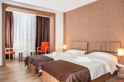 Postel nebo postele na pokoji v ubytování HB Brilliant