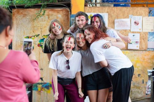 a group of people with paint on their faces at Wander Thirst in Kathmandu