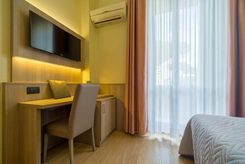 Postel nebo postele na pokoji v ubytování Hotel Est Piombino