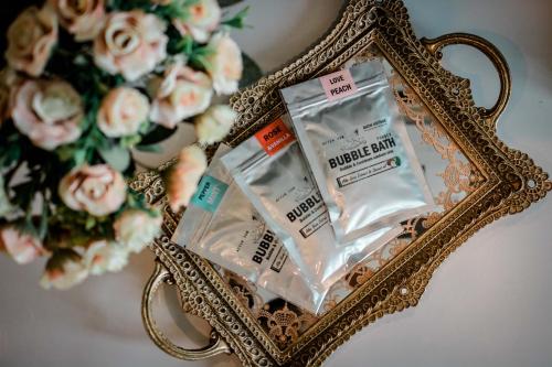 two packages of drugs in a mirror next to a bouquet of flowers at A.LIST HOTEL in Songkhla