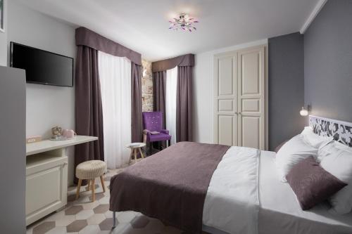 Letto o letti in una camera di Noemi's rooms
