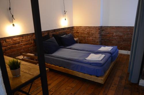 A bed or beds in a room at Generaator Sofia