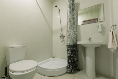 a bathroom with a toilet and a sink at ARTSIV Guesthouse in Dilijan