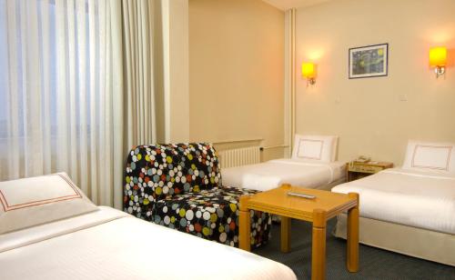 Postel nebo postele na pokoji v ubytování Ilkay Hotel
